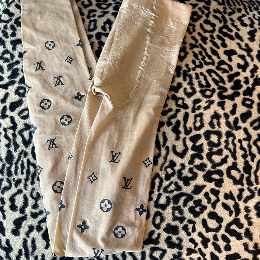 Small Louis Vuitton nude pantyhose.